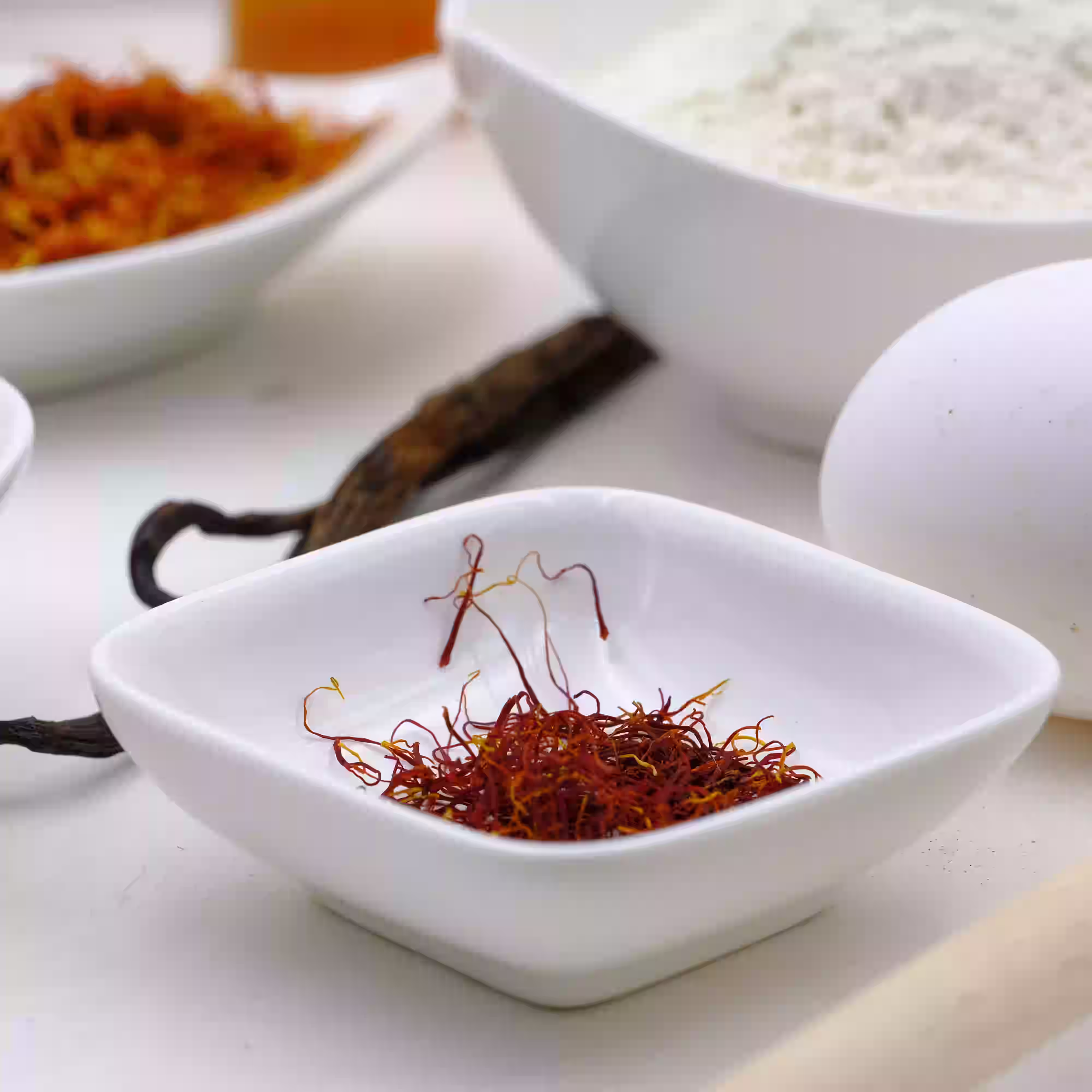 Saffron threads displayed with natural ingredients highlighting traditional use for wellness and overall health.